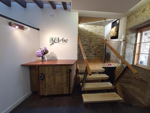 a room with a staircase and a stair case at Urbe Sanchina - Hostel & Suites in Guarda