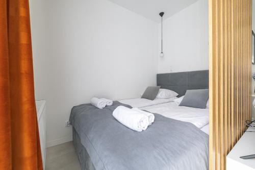 Posteľ alebo postele v izbe v ubytovaní Apartamenty Central Gdańsk Q4Apartments