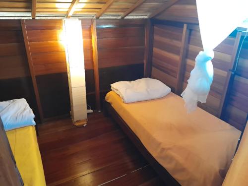 Postel nebo postele na pokoji v ubytování Les Collines De Niassam