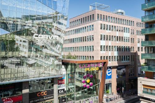 a group of tall buildings in a city at Corvin 5 Stars Luxury Apartment with Free Parking in Budapest