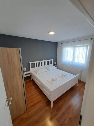 Postel nebo postele na pokoji v ubytování Holiday House Meri