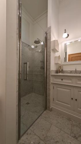 a bathroom with a shower and a sink at Château de Berg in Berg-sur-Moselle