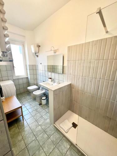 a bathroom with a shower and a sink and a toilet at Doria home-Saint Peter's View in Rome