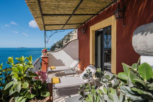 a balcony of a house with a view of the ocean at Albergo Miramare Positano in Positano