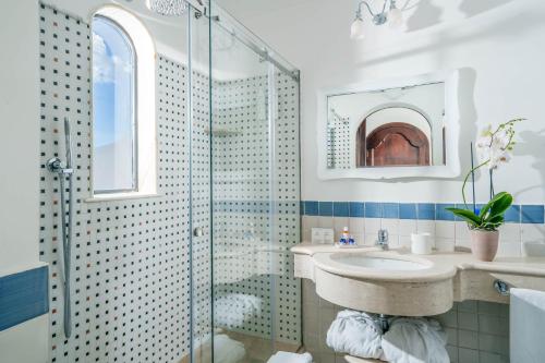 a bathroom with a sink and a shower at Albergo Miramare Positano in Positano