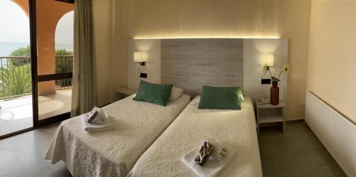 Postel nebo postele na pokoji v ubytování Hotel Sancho III