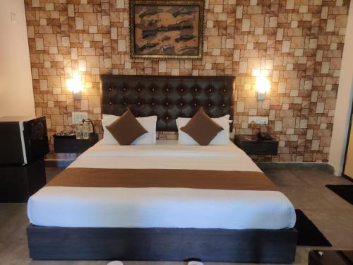 a bedroom with a large bed in a room at The Mountain Shades Resort in Madikeri