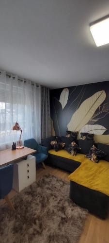 a living room with a couch and a table at URBAN HARMONY APARTMENT Maribor in Maribor