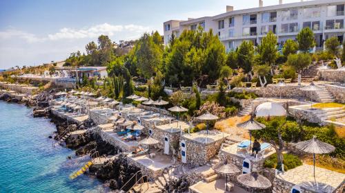 an aerial view of the hotel and the water at Stone Beach Residence - Adults Only Resort in Qeparo