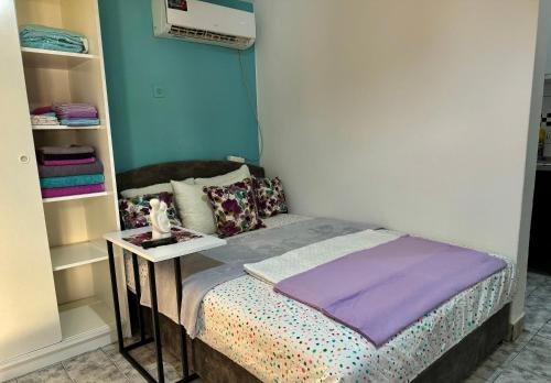 Un ou plusieurs lits dans un hébergement de l'établissement ApartHotel Maxim