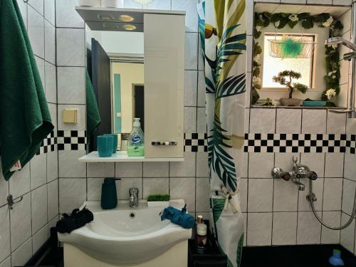Salle de bains dans l'établissement ApartHotel Maxim
