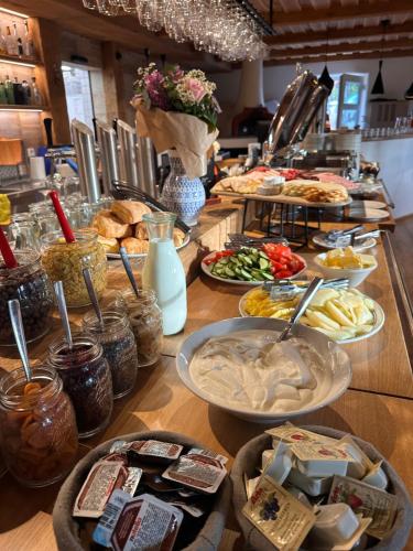 a buffet with many plates of food on a table at Chata Hradečanka in Horní Malá Úpa