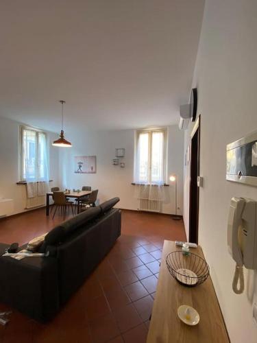 a living room with a couch and a table at Host San Pietro in Formigine