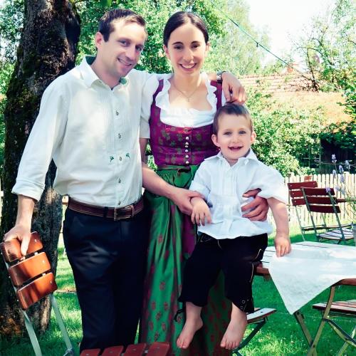 a man and a woman and a child posing for a picture at Gasthaus Georg Ludwig Maising in Pöcking