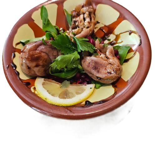 a bowl of food with shrimp and lemon slices at Hotel Restaurant Toscana Naumburg in Naumburg
