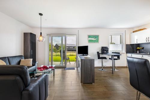 a living room with a couch and a table at Haus Kellenburg in Albstadt