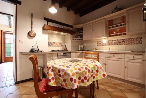 a kitchen with a table with a polka dot table cloth at Mentaxuria in Mendionde