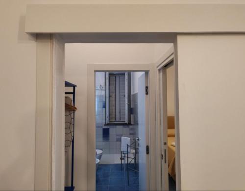 a view of a living room and a dining room at Archi Suite Canneto in Canneto