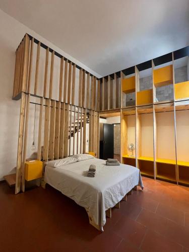 a bedroom with a bed in a room at Palazzo Verrone in Bari