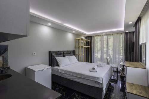 a hotel room with a bed and a window at Terra Garden Hotel in Kemer