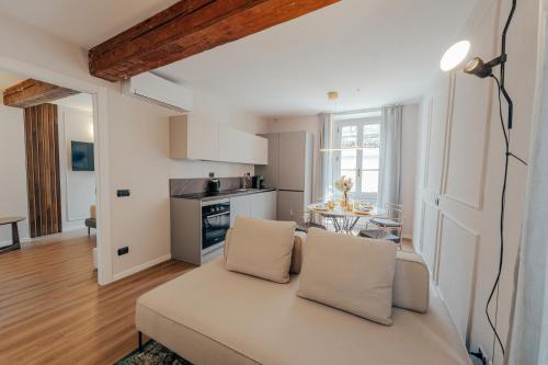 a living room with a couch and a table at L'Altana City House in Brescia