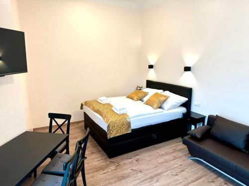 En eller flere senge i et værelse på Atlas Apartment