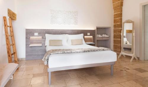 Postel nebo postele na pokoji v ubytování Masseria Elysium