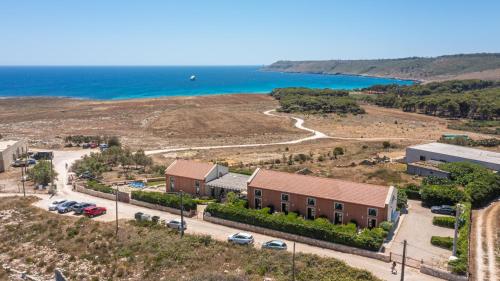 an aerial view of a building next to the ocean at Palascìa Wellness Relais in Otranto