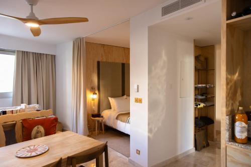 a bedroom with a bed and a table in a room at MOB HOTEL Cannes in Cannes
