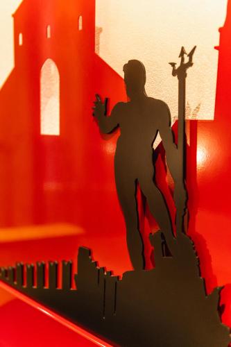 a figurine of a man running on a castle at Art Hotel Commercianti in Bologna