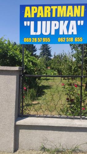 a gate with a sign that reads argentinian istg sqor at Apartment Ljupka in Pančevo