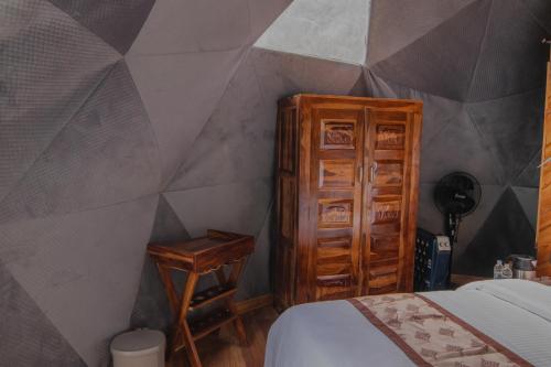 Voodi või voodid majutusasutuse The Alpinist Glamping Resort toas