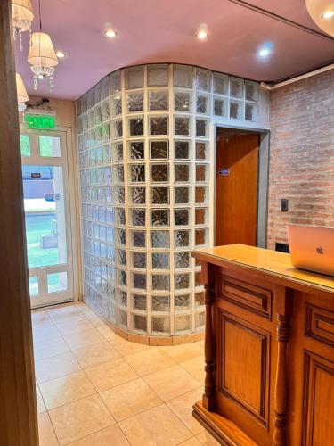 a wine cellar with a wall of wine bottles at Hotel Cuesta del Viento in San Juan