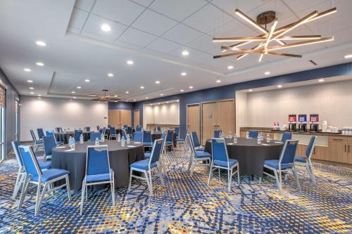 a conference room with tables and chairs and a ceiling at Hampton Inn & Suites by Hilton Shenandoah The Woodlands in The Woodlands