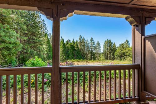 a screened in porch with a view of the woods at Best Western Stagecoach Inn in Pollock Pines