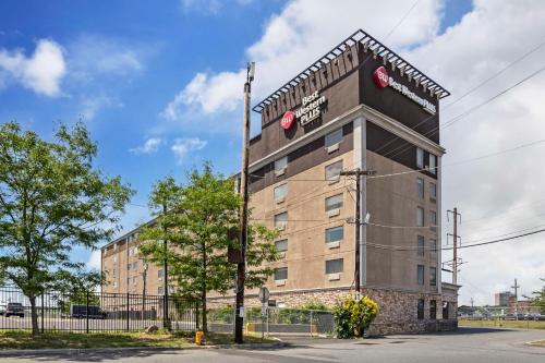 a building with a sign on the side of it at Best Western Plus Newark Airport West in Newark
