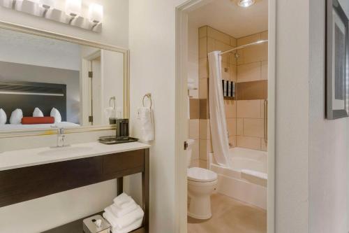 a bathroom with a sink and a toilet and a tub at Best Western Corvallis in Corvallis