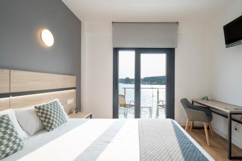Postel nebo postele na pokoji v ubytování Hotel Alda Vía Norte