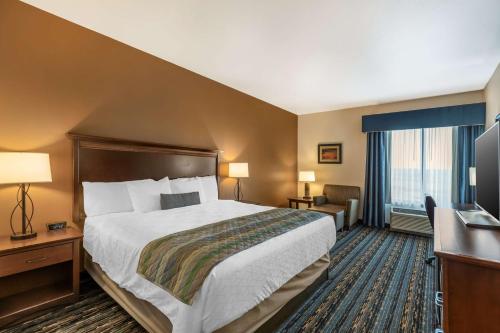 a hotel room with a bed and a television at Best Western PLUS Casper Inn & Suites in Casper