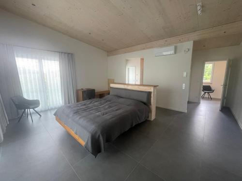 Ένα ή περισσότερα κρεβάτια σε δωμάτιο στο Ferienhaus-Wasserkuppe-Rhön