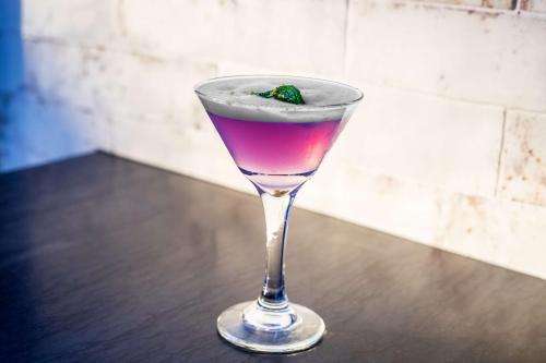 a drink in a glass sitting on a table at Hyatt Place New York Chelsea in New York