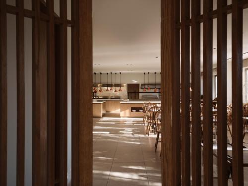 a kitchen and dining room with a table and chairs at Planos Deluxe in Zakynthos Town