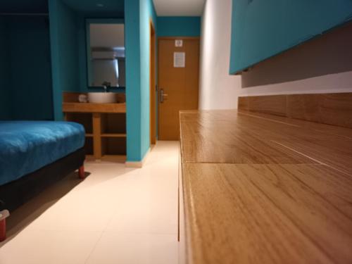 Ένα ή περισσότερα κρεβάτια σε δωμάτιο στο Hotel Kavia Mazatlán