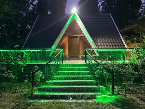 a house with green lights on the stairs at Zenor in Quba