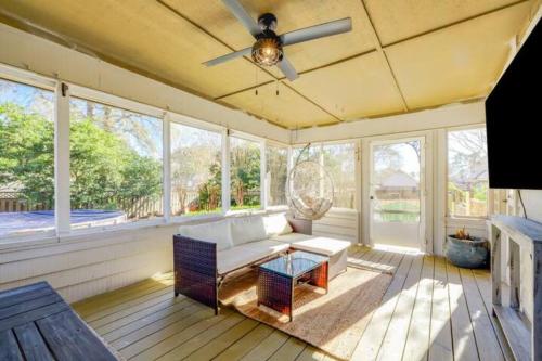 a living room with a couch and a ceiling fan at Spacious House Near Savannah Airport - 5 BR in Savannah
