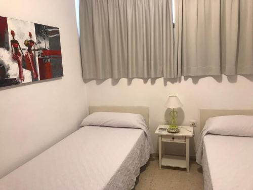 Postel nebo postele na pokoji v ubytování Apartamentos Quintero – Adults Only