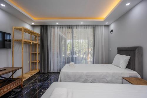 Postel nebo postele na pokoji v ubytování Terra Garden Hotel
