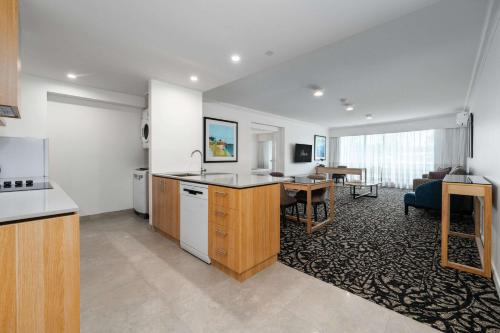 an open kitchen and living room in a apartment at Quality Hotel Parklake Shepparton in Shepparton