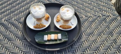 a plate of food with two drinks on a table at DOMAINE CARDU in Cardo-Torgia