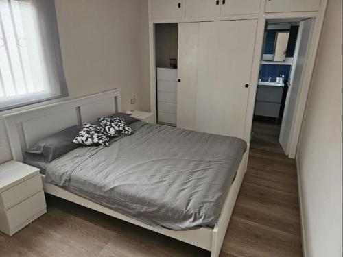a small bedroom with a bed and a closet at La Cañada in Partida de La Cañada